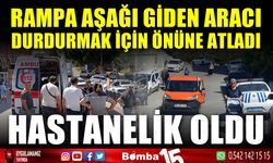 Rampa aşağı hareket eden aracı durdurmak isterken hastanelik oldu