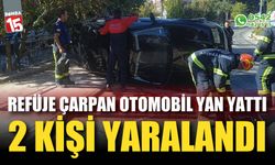 Refüje çarpan otomobil yan yattı