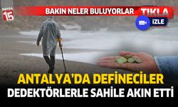 Antalya'da fırtınaya rağmen defineciler dedektörlerle sahile akın etti