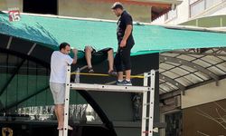 Antalya'da evinin balkonundan işyerinin tentesine düştü