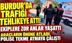 Burdur’da Cadde Üzerinde Hareketli Anlar! Araçların Önüne Atladı, Polise Direndi